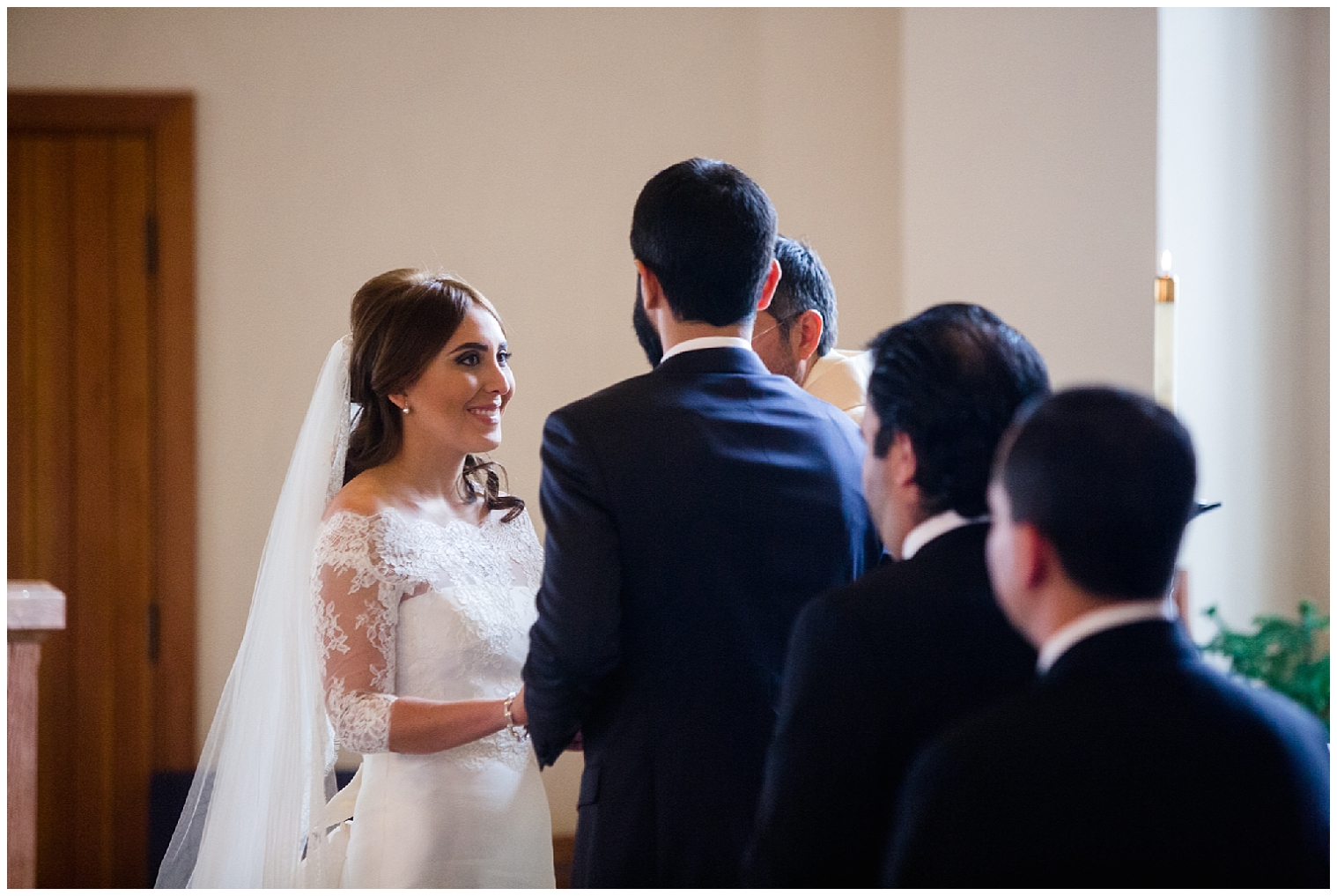Bride looks up at her groom during their beaver creeek chapel wedding ceremony.