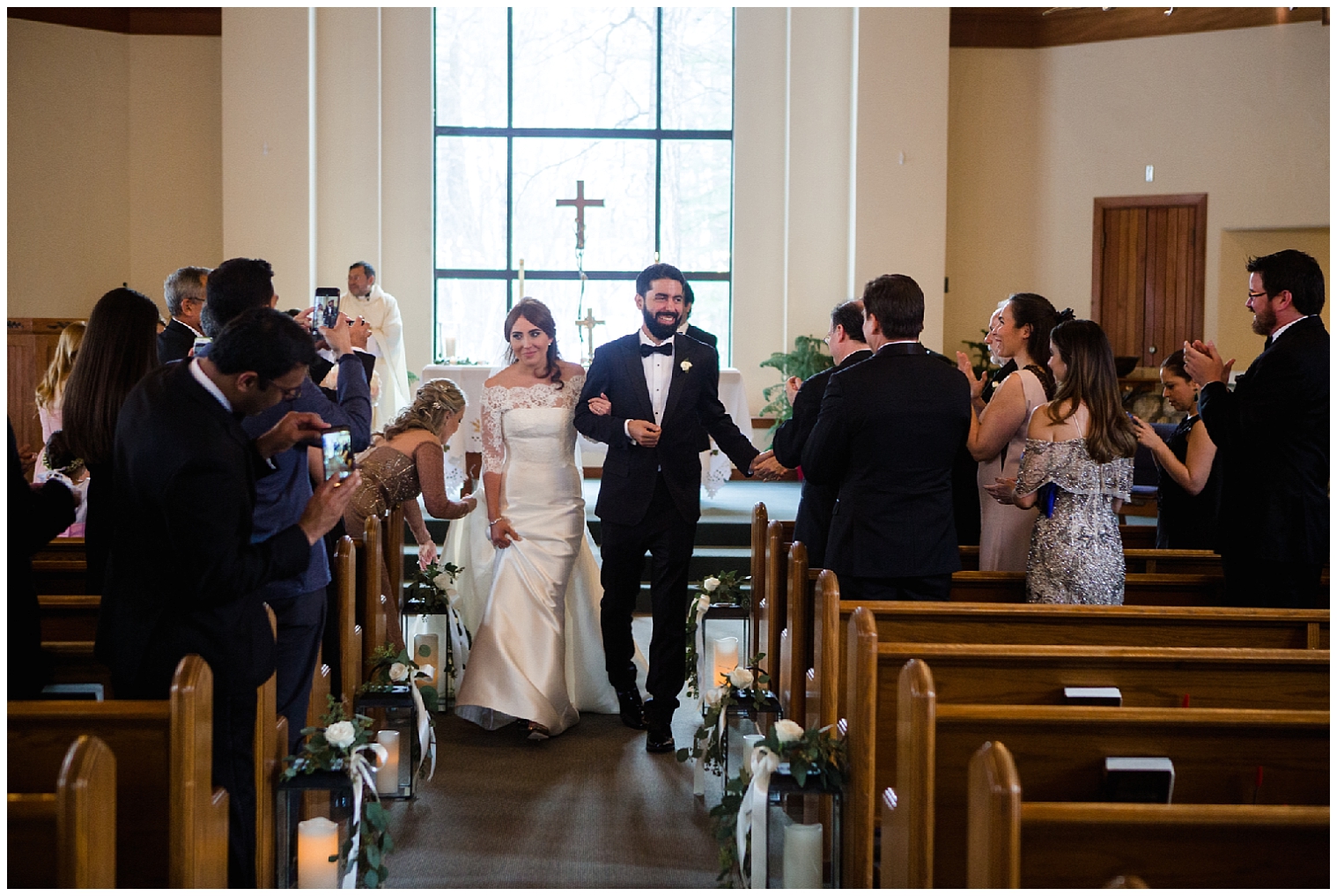 The wedding couple walk back down the aisle together at Beaver Creek Wedding Chapel