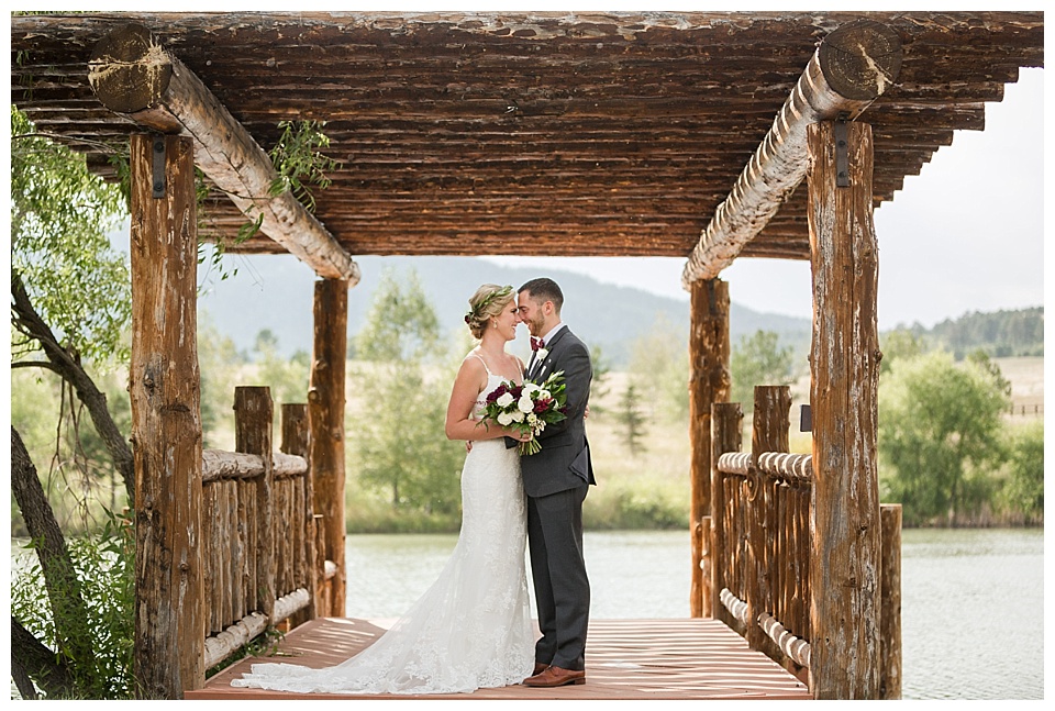 bride and groom pose for portraits taken by a colorado mountain wedding photographer
