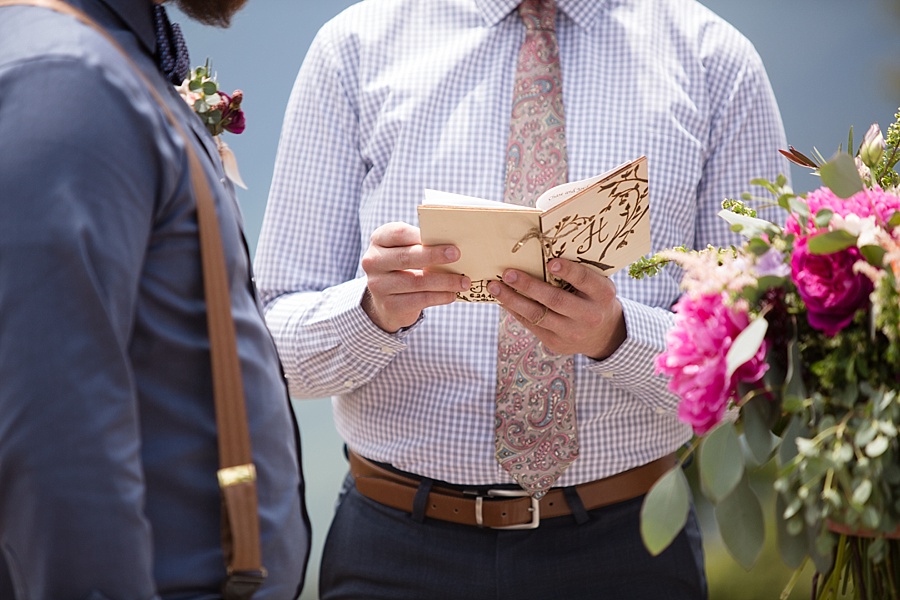 detail of officiant reading out of his book in aspen colorado 