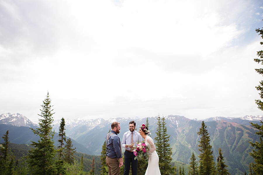 bride and groom laughing during their elopement ceremony in aspen colorado 