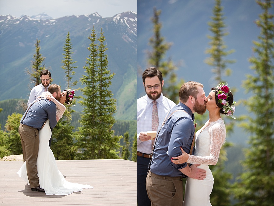 bride and groom kiss and become husband and wife at little nell wedding deck in aspen