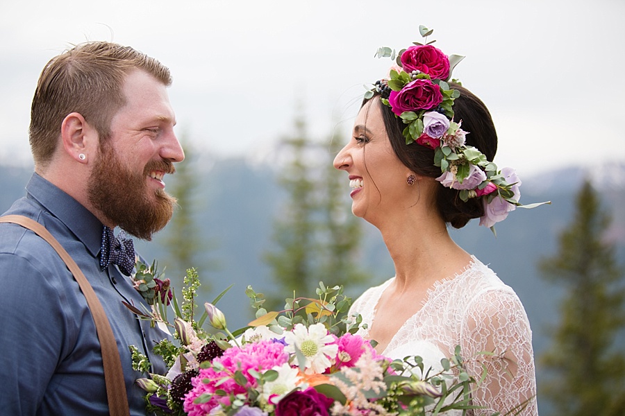 bride and groom smile at each other after becoming husband and wife in aspen colorado 