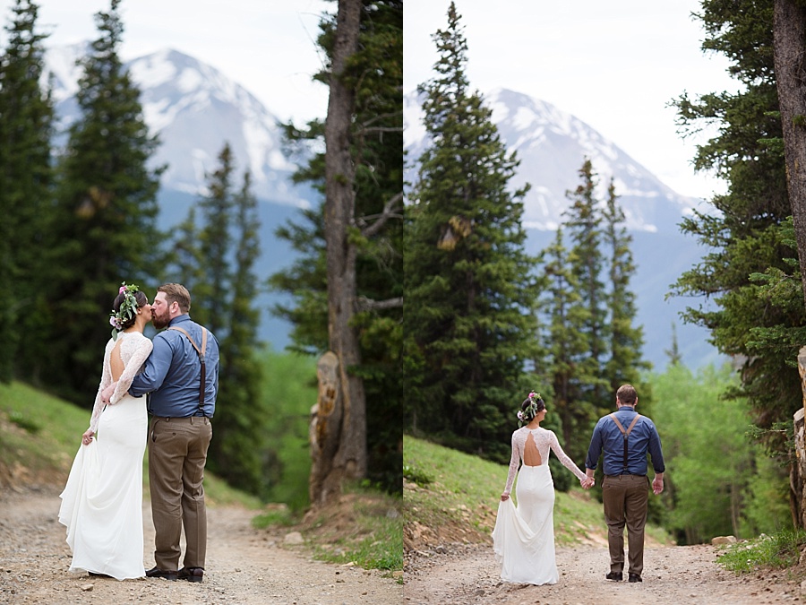 bride and groom walk through the mountains together after their aspen elopement
