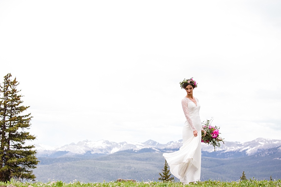 bride swings her dress in aspen colorado in the summer 