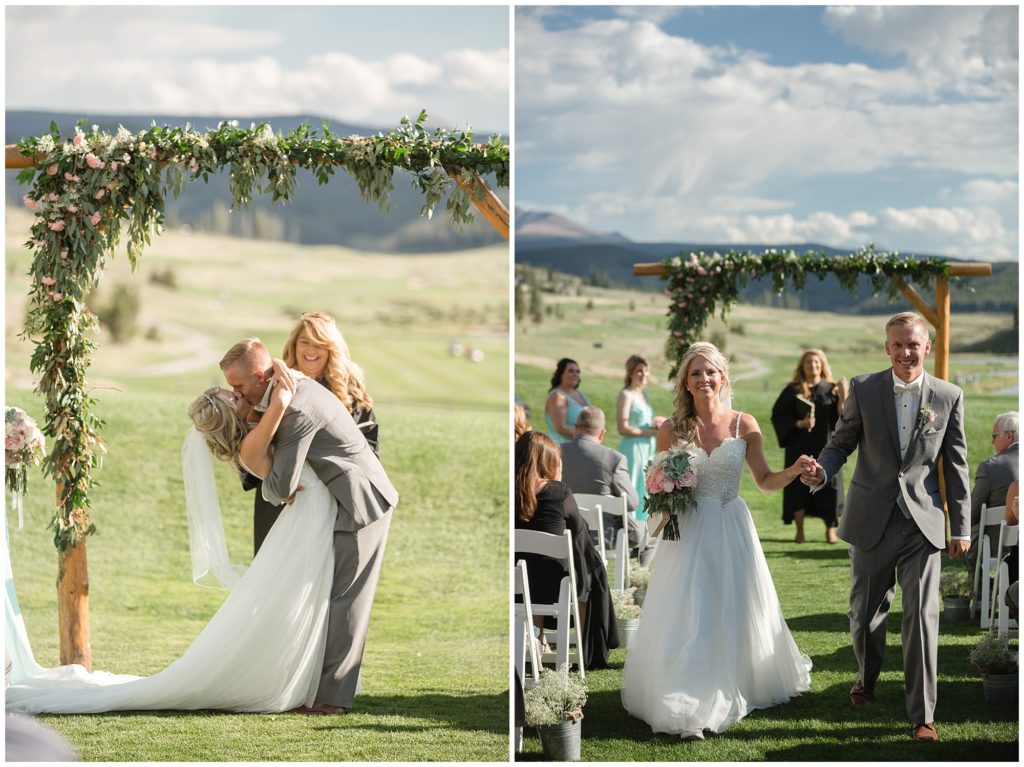 groom dips bride for first kiss at keystone ranch colorado.  wedding arch designed by Pots & Petals