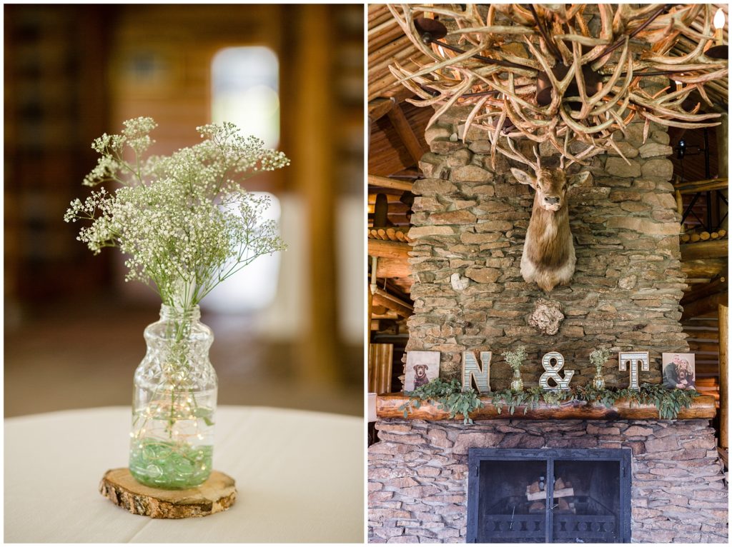 wedding reception table flowers and fireplace with stuffed deer and antlers letters and photos