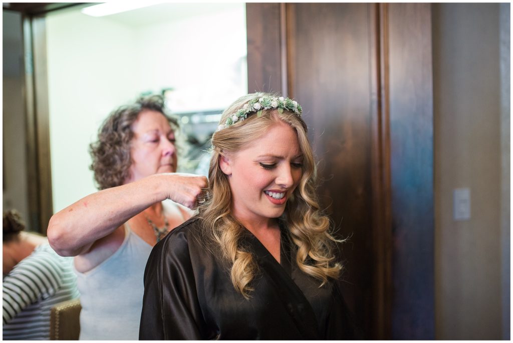 bride getting her hair done on her wedding day at gorrono ranch