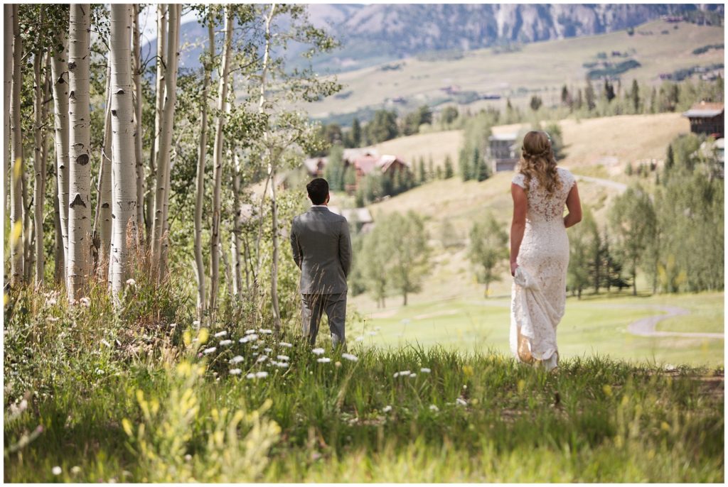 bride walking to meet her groom for their first look in Telluride