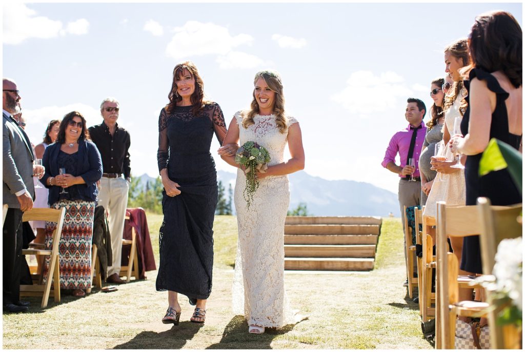 bride walks down aisle with her mother in telluride Colorado 