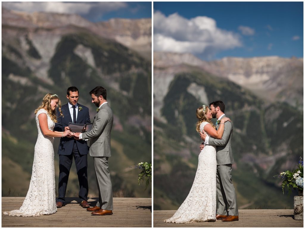 bride and groom exchange rings and share their first kiss with stunning mountain backdrop in Telluride Colorado 
