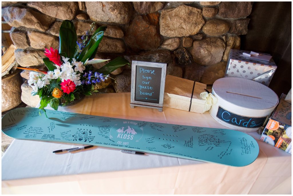 wedding detail of snowboard as guest book