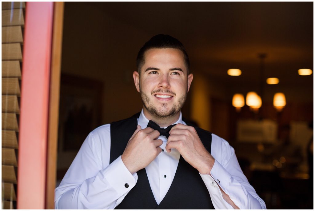 groom getting ready for his wedding at timber ridge lodge Colorado 