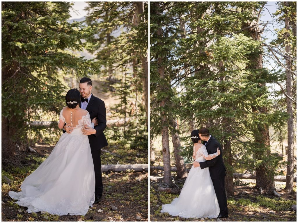 groom looks at bride during their first look in timber ridge lodge in keystone colorado