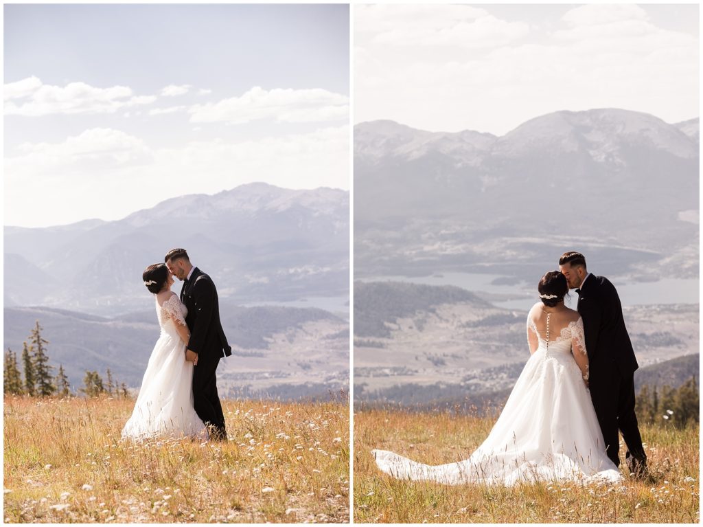 bride and groom kiss at the mountain top in keystone on their wedding day at timber ridge lodge