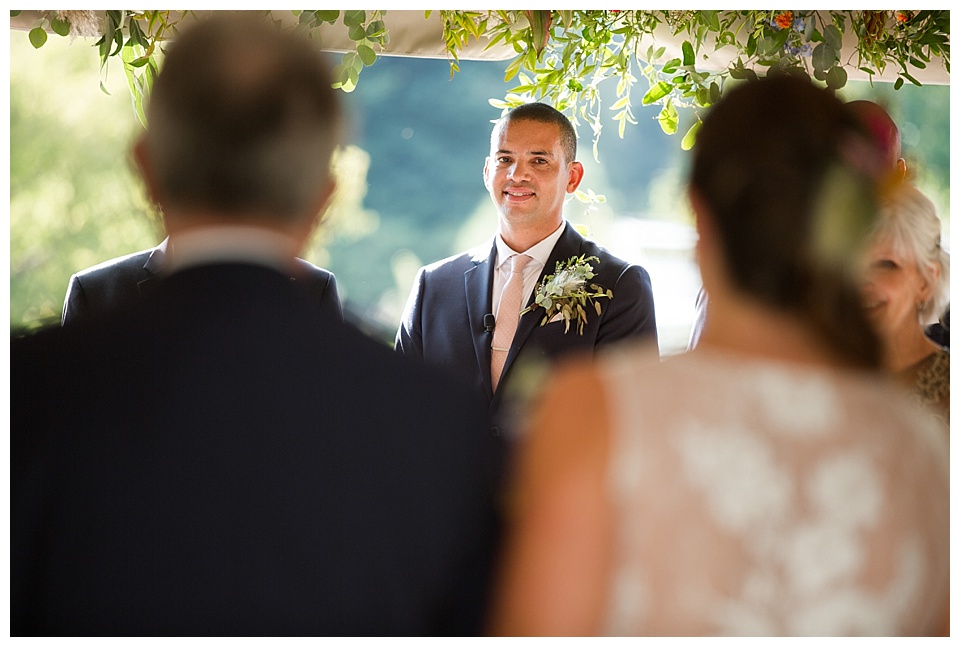 groom tearing up when sees bride coming down the aisle