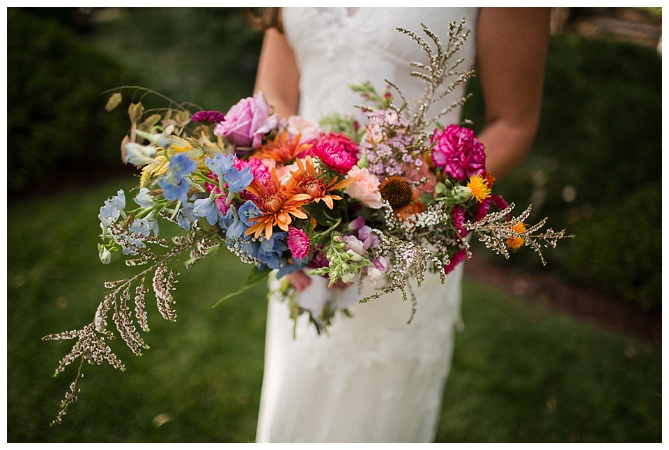detail of colorful wedding florals at denver botanic gardens