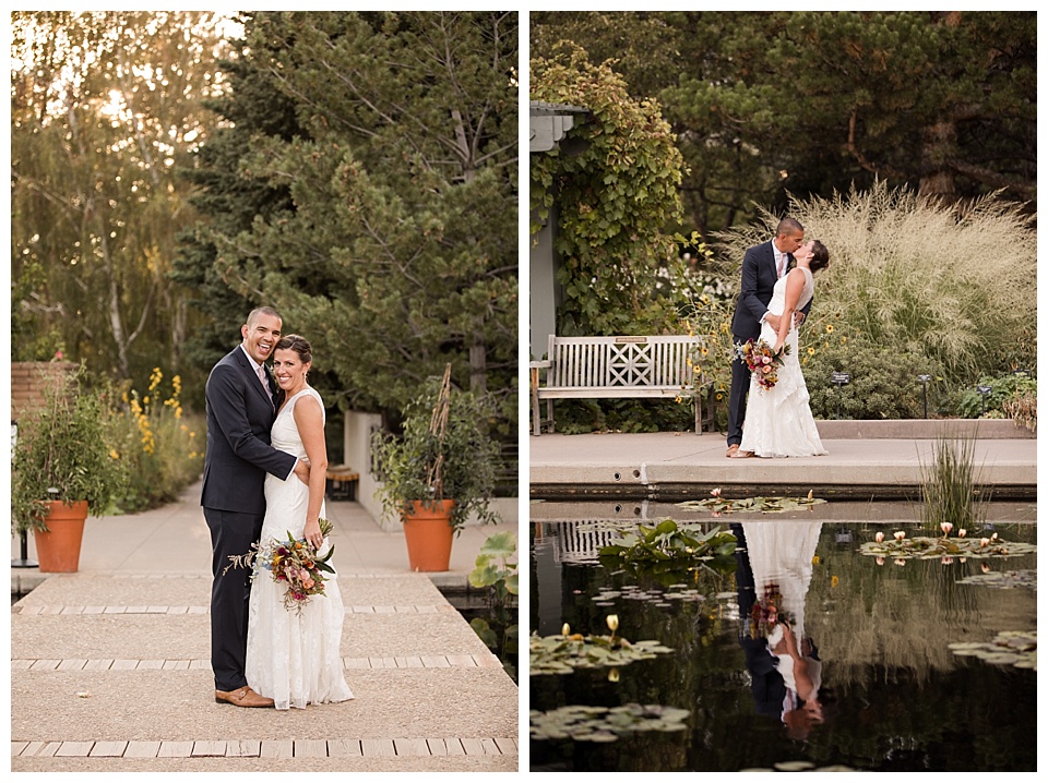bride and groom kiss near water with reflection and trees
