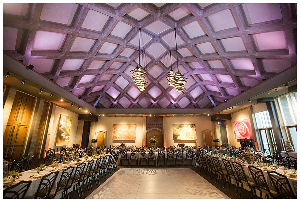 wide shot of wedding venue with purple ceilings 