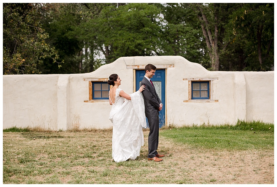bride taps groom's shoulder for their first look at oxford road farm