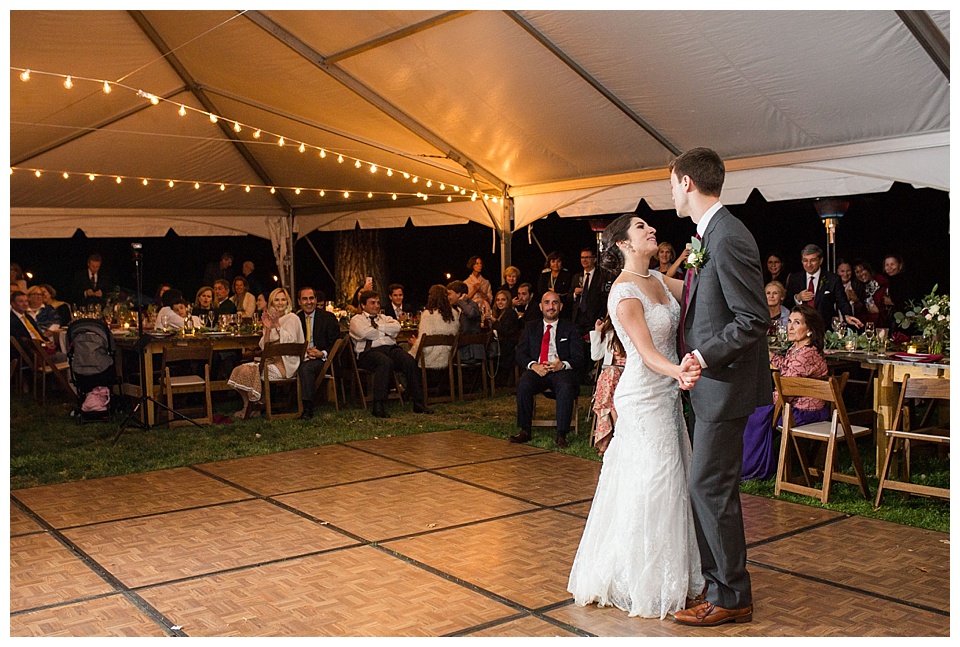 bride and groom dancing at their reception in a tent at oxford road farm