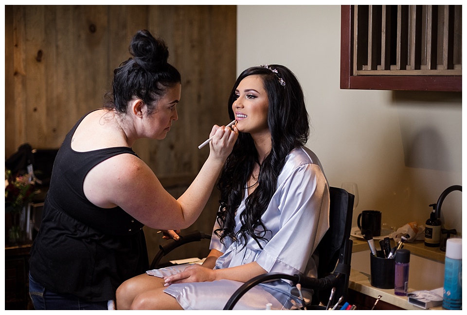 bride getting her wedding day makeup done at devil's thumb ranch