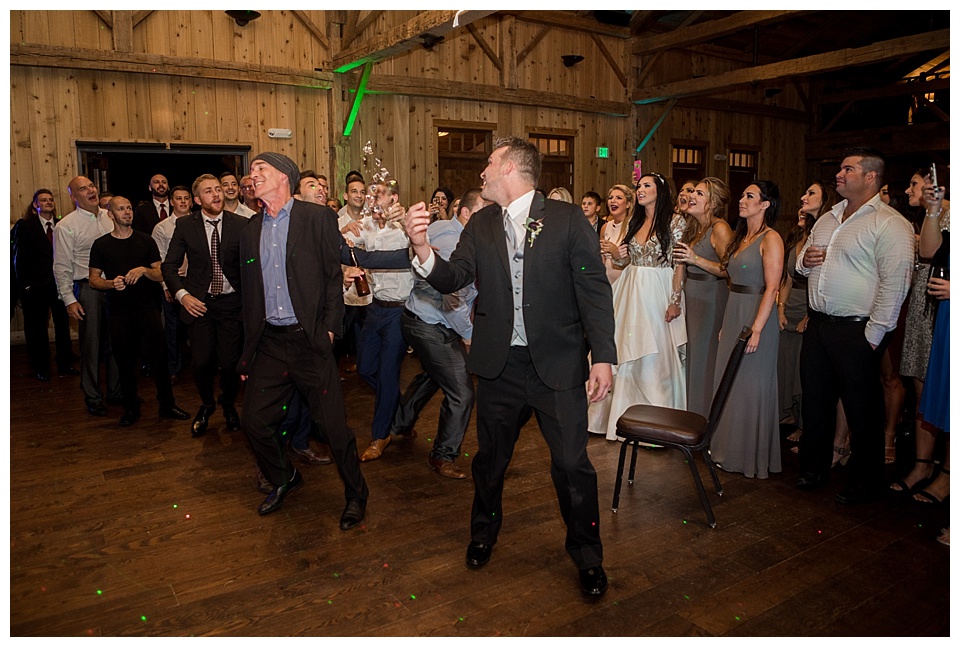 groom throws garter and people and drinks fall down