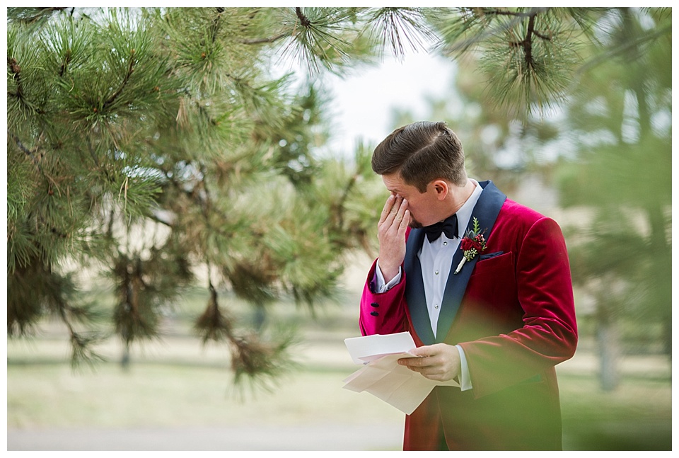 groom crying reading letter from his bride before the wedding