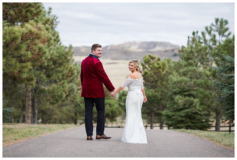 bride and groom look back at their colorado mountain wedding photographer