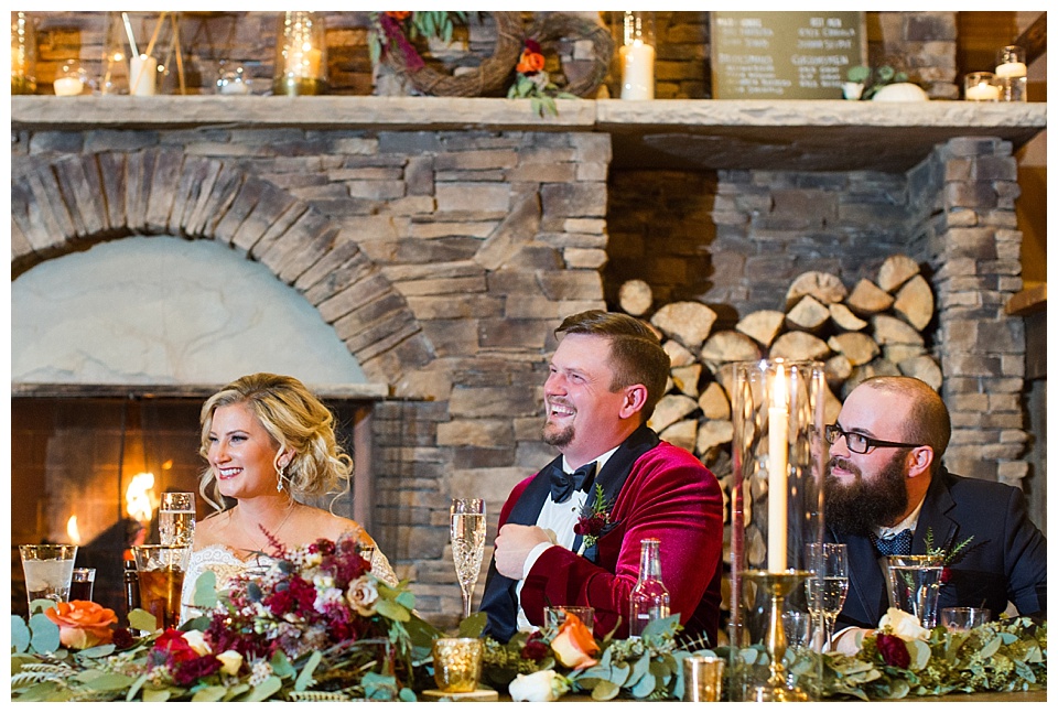 bride and groom laughing during wedding reception toasts at spruce mountain ranch