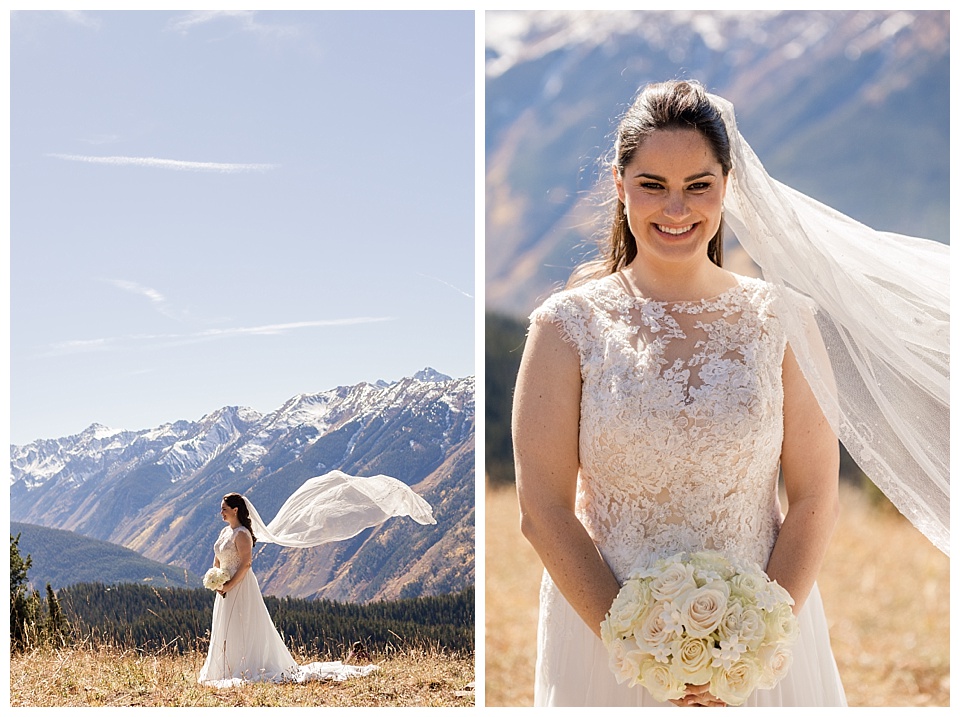bride poses with her bridal bouquet at the top of the mountains in aspen