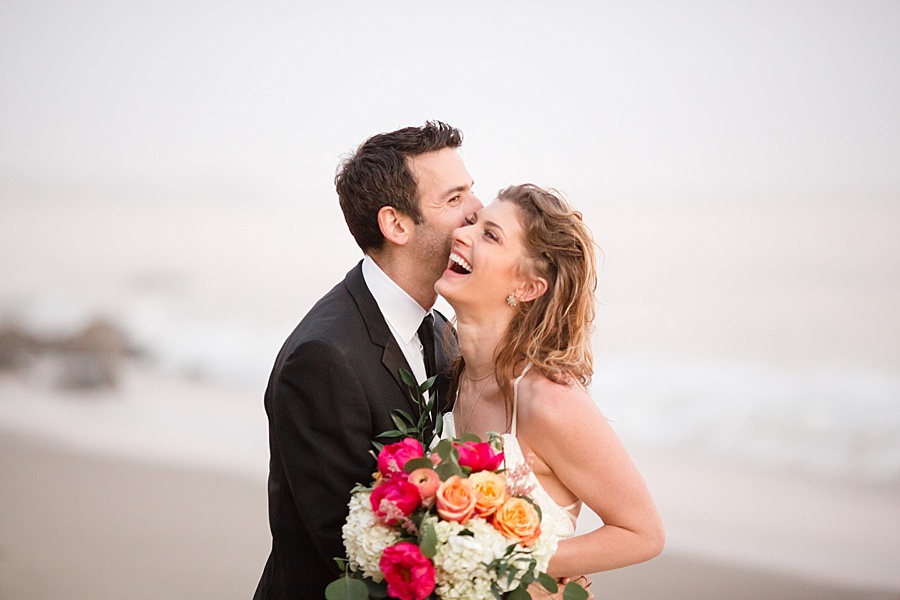 bride and groom laughing together at matador beach