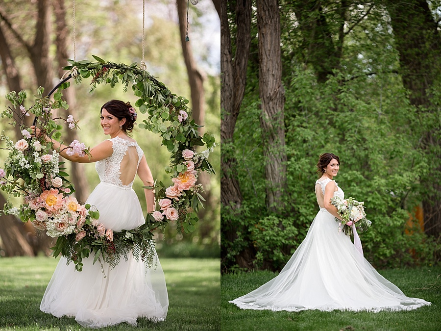 bride poses with spring greenery and floral swing