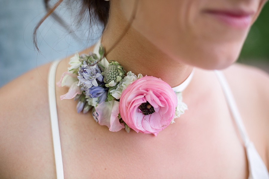 bride wears handmade floral choker