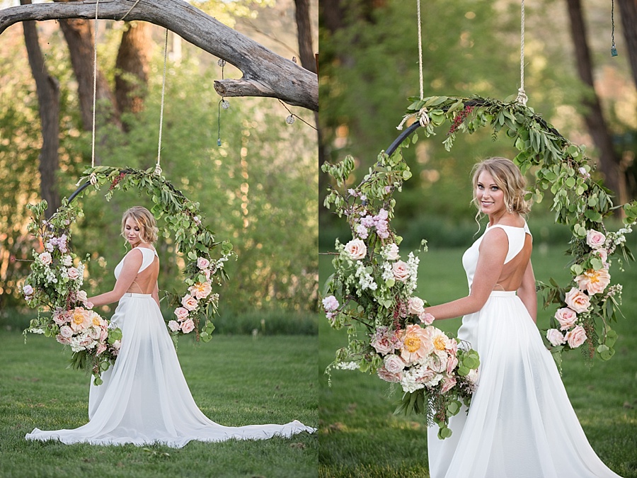 bride poses with stunning pastel floral sing