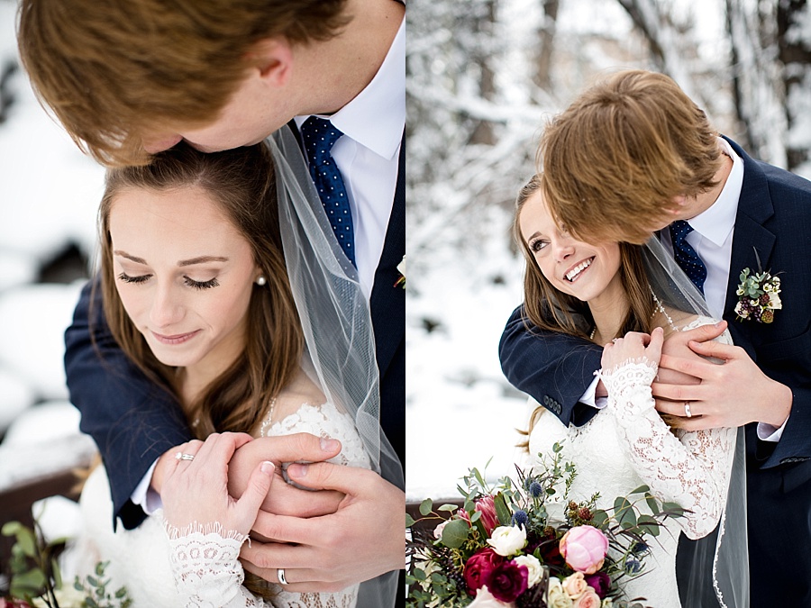 groom holding bride in the snow after their wedding in beaver creek