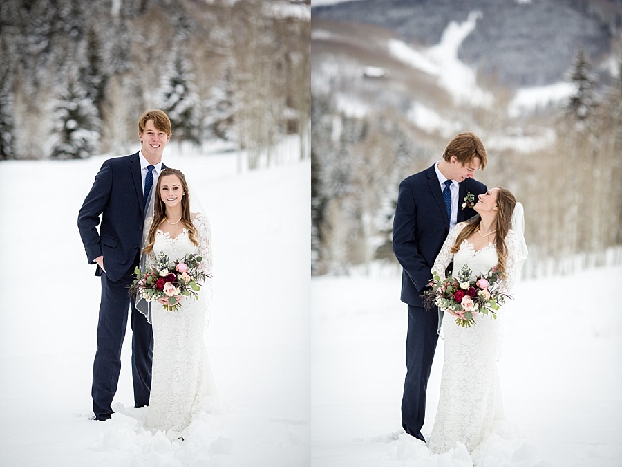 bride and groom pose in front of stunning snowy colorado mountains in beaver creek