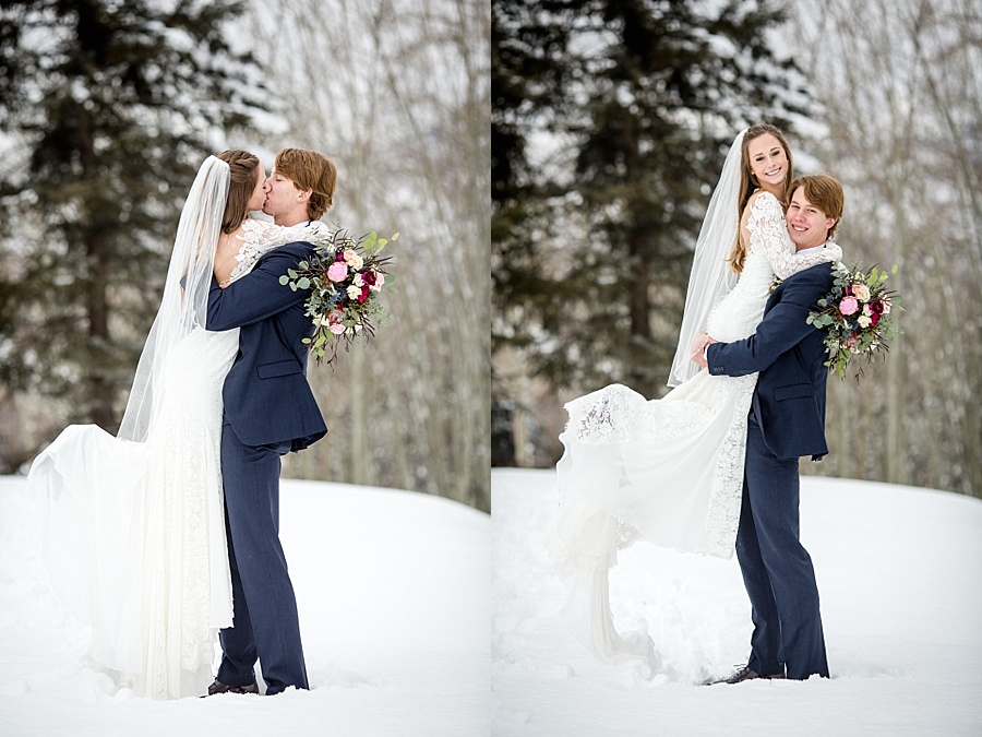 tall groom picks up short bride and kisses her in the snow in colorado