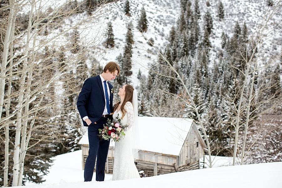 bride and groom gazing at each other in the snow in beaver creek