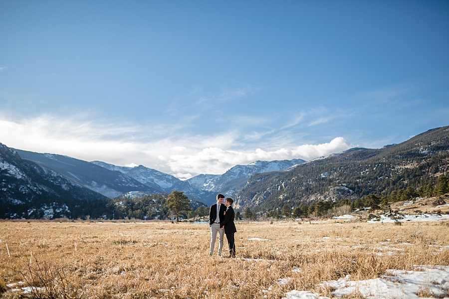 two grooms pose together after eloping in breckenridge colorado