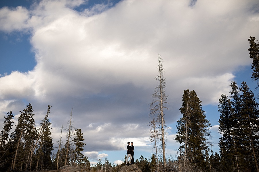 two grooms pose in breckenridge after their gay elopement