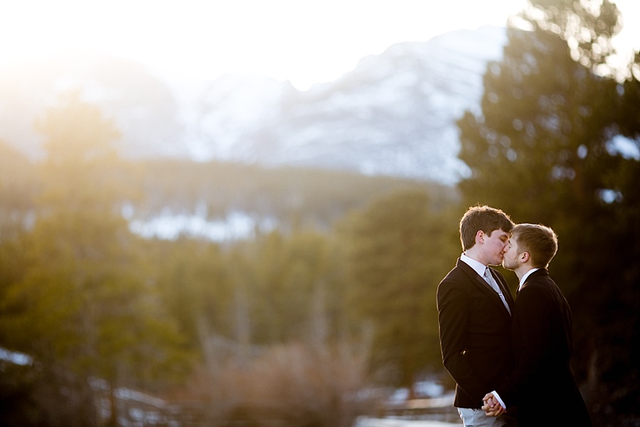 two grooms kiss during their portraits after their gay elopement in breckenridge