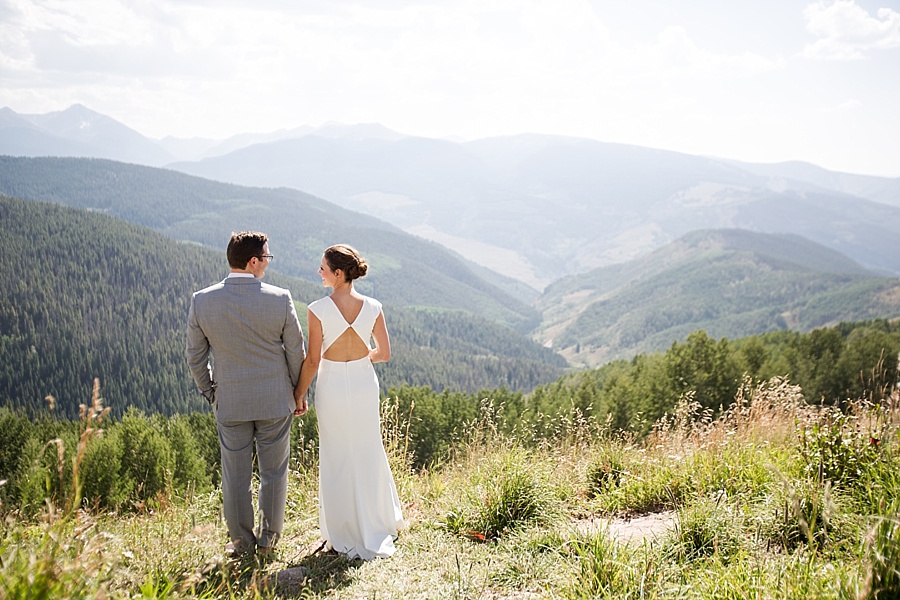 bride and groom look at each other at the mountaintop in vail colorado 