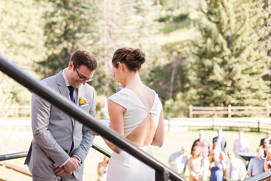 groom laughing during wedding ceremony at lion square lodge in vail 