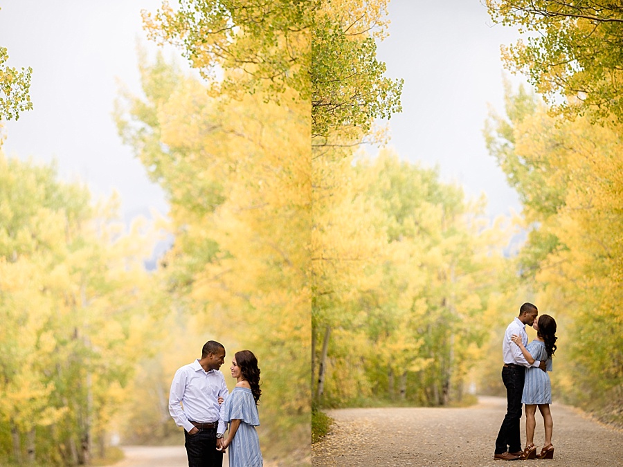 colorful yellow aspens in the fall as a backdrop for engagement photos 