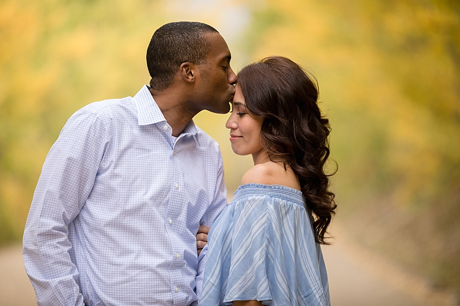 biracial engaged couple pose for their coloraod mountain wedding photographer 