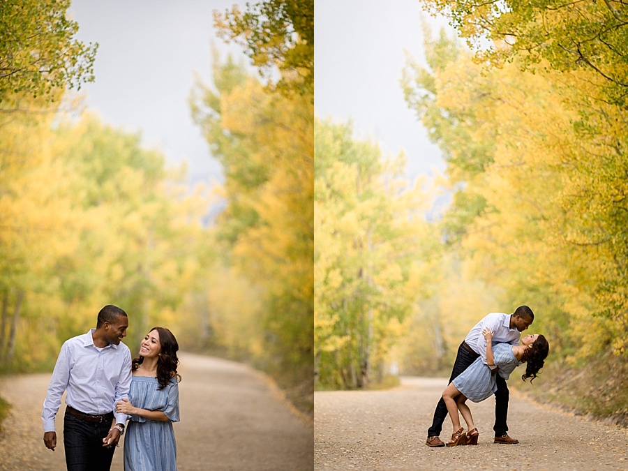 groom to be dips bride to be and kisses her with stunning yellow aspen background 