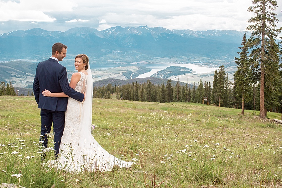 bride and groom pose for their bridal portraits at apenglow stube in keystone colorado 