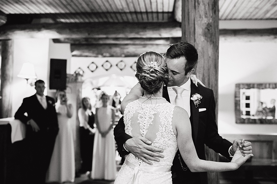 groom touching bride's face during first dance in keystone 