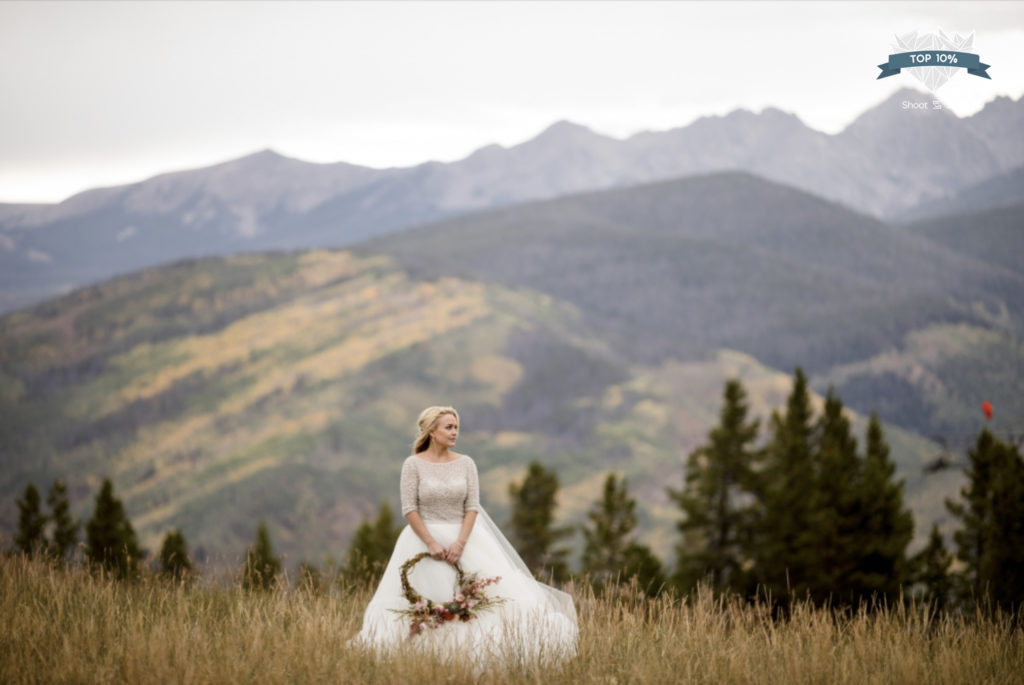 Bride in the fall at the top of Vail Mountain Wedding Deck